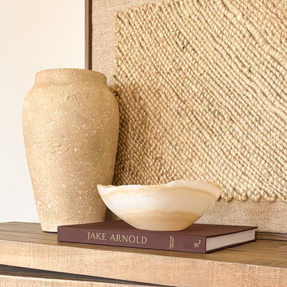 Luxury white and amber onyx decorative bowl displayed in modern interior