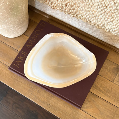 Decorative hand carved onyx bowl made from white and amber natural stone