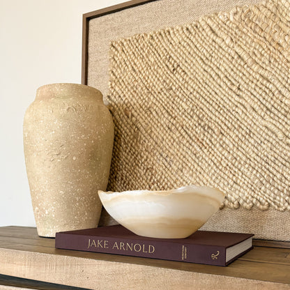 Luxury hand carved onyx bowl in white and amber tones for elegant home decor