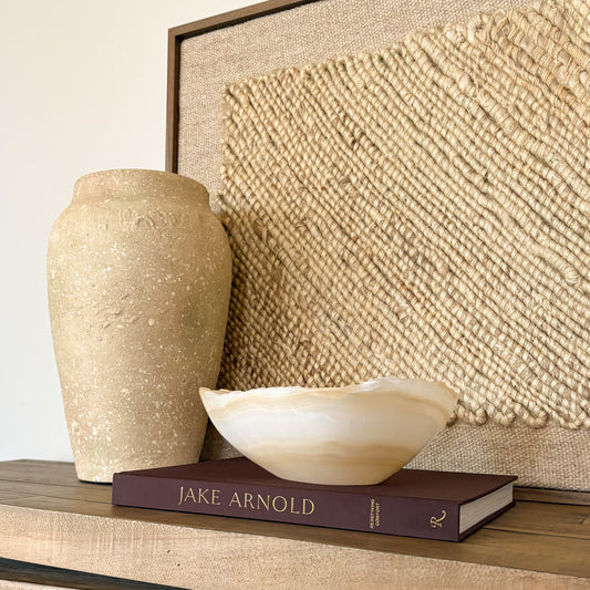 Luxury hand carved onyx bowl in white and amber tones for elegant home decor