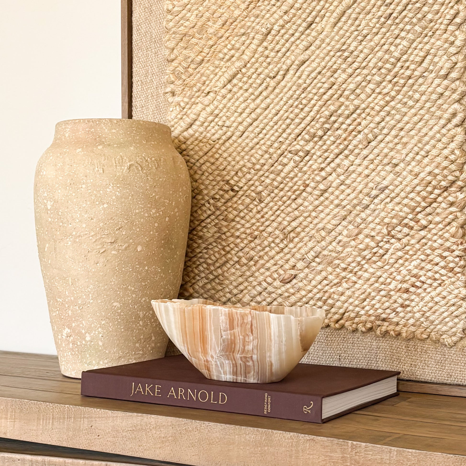 Hand carved amber onyx bowl with natural stone veining and polished finish