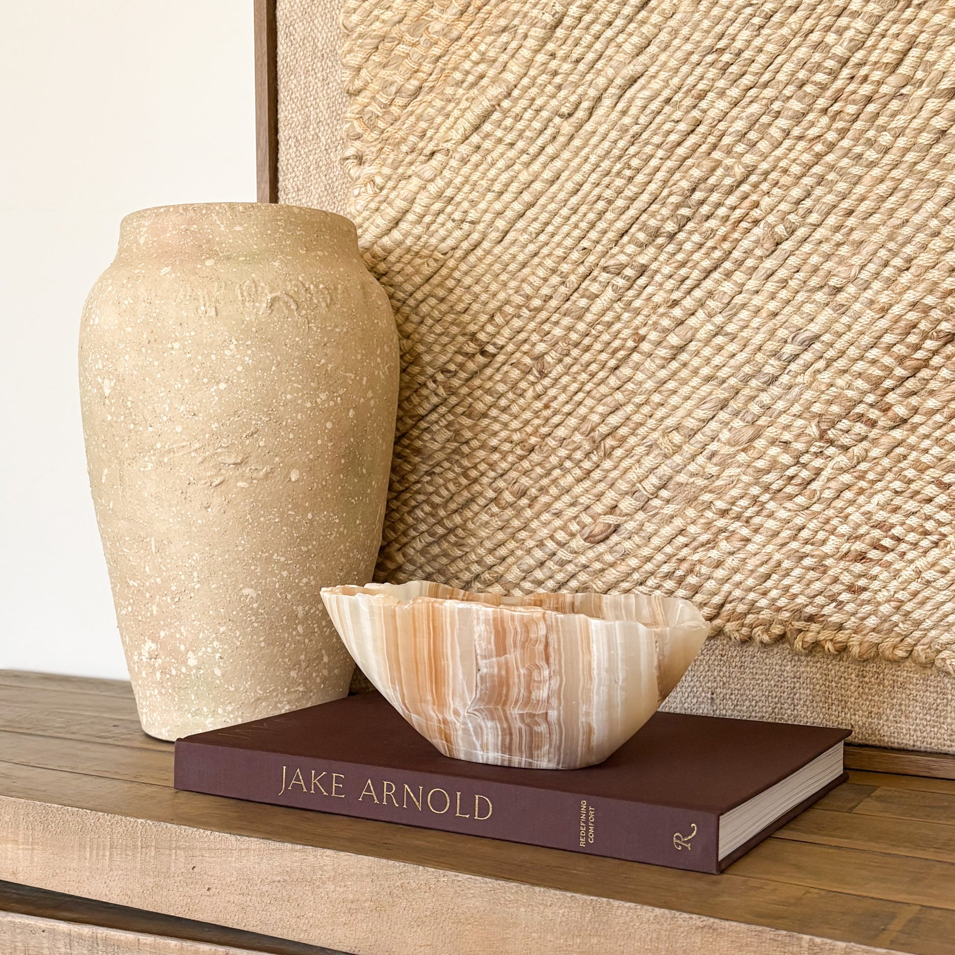 Artisan hand carved amber onyx bowl showcasing warm golden hues