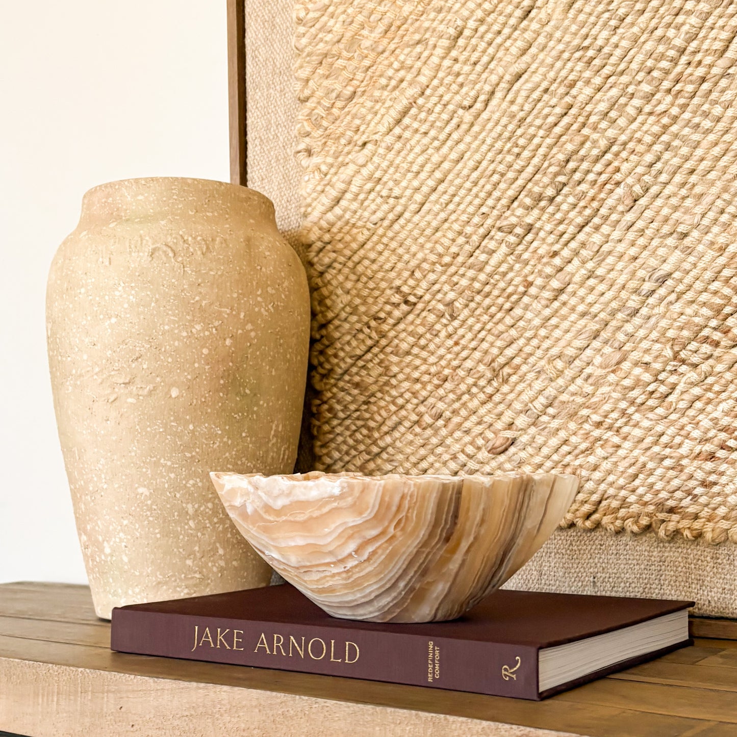 Polished amber onyx decorative bowl in warm golden tones