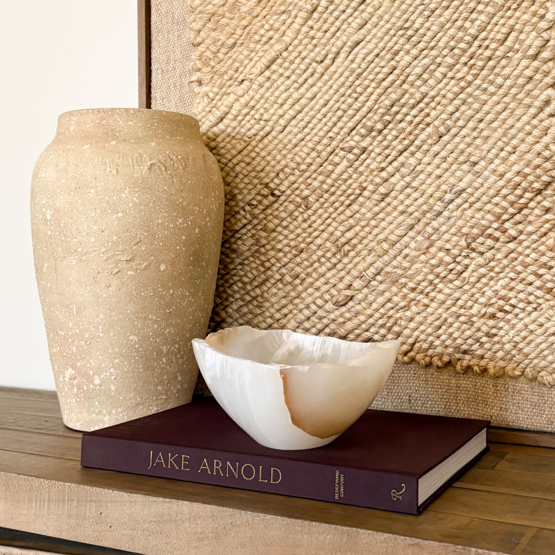 Sculpted amber onyx bowl with organic stone texture