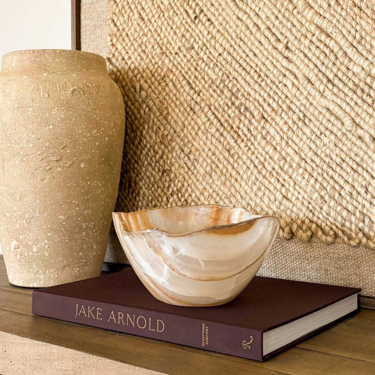 Natural amber onyx bowl hand carved from solid stone with smooth polished surface and rich honey-gold tones.
