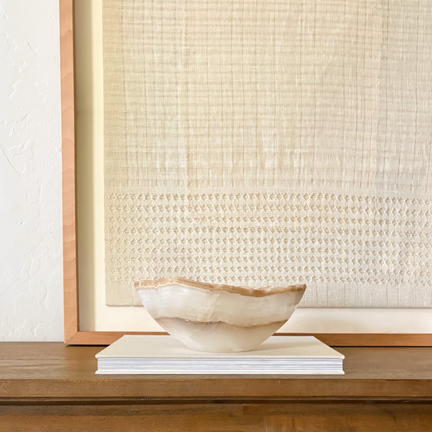 Hand carved amber onyx bowl with natural stone patterns and polished finish