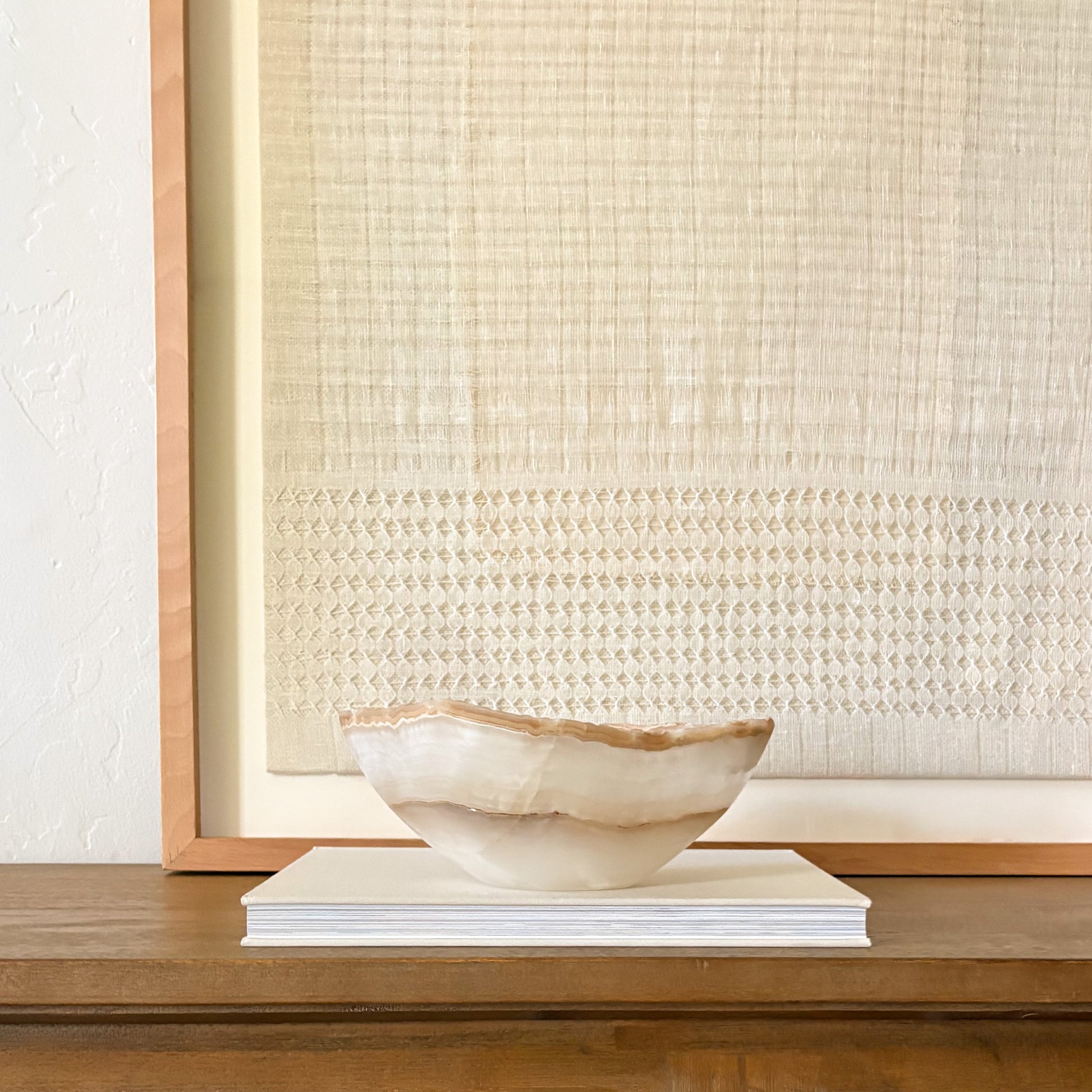 Hand carved amber onyx bowl with natural stone patterns and polished finish