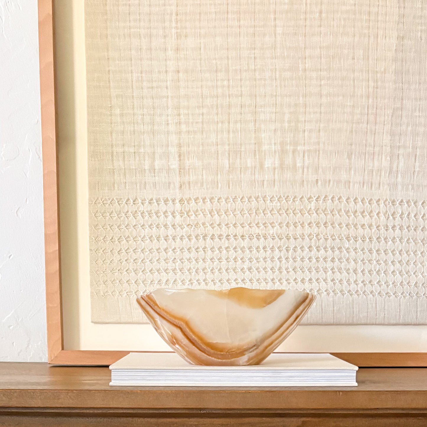 Hand carved onyx bowl displayed as modern home décor accent