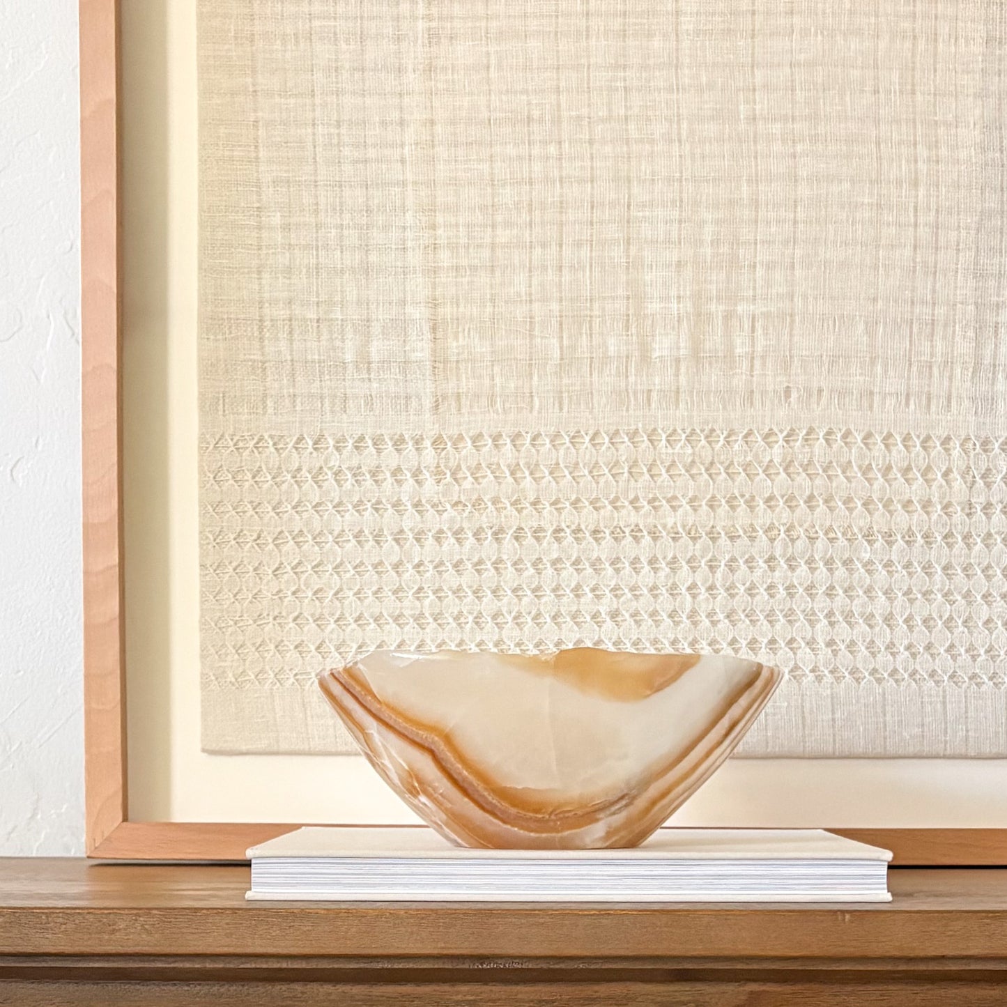 Amber onyx bowl used as luxury console table centerpiece
