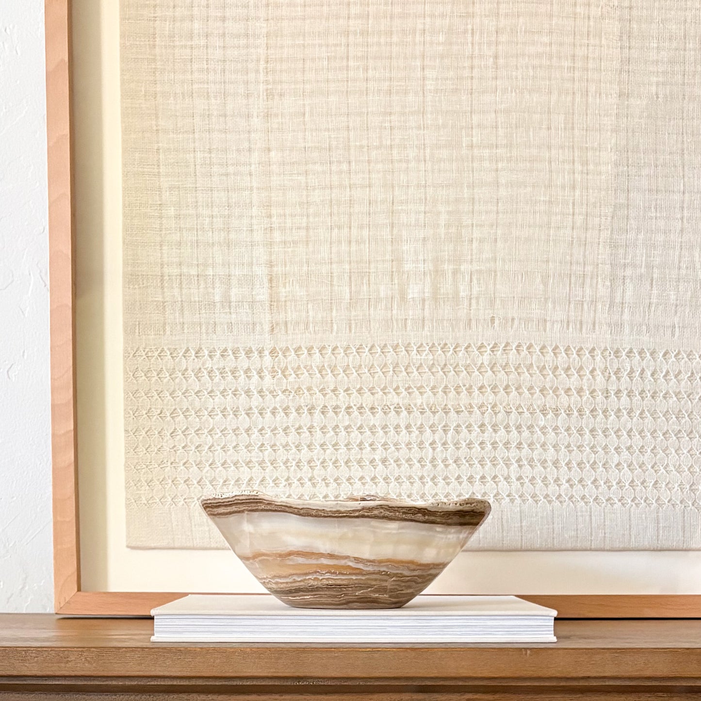 Elegant hand-carved amber onyx decorative bowl in warm honey and golden earth tones