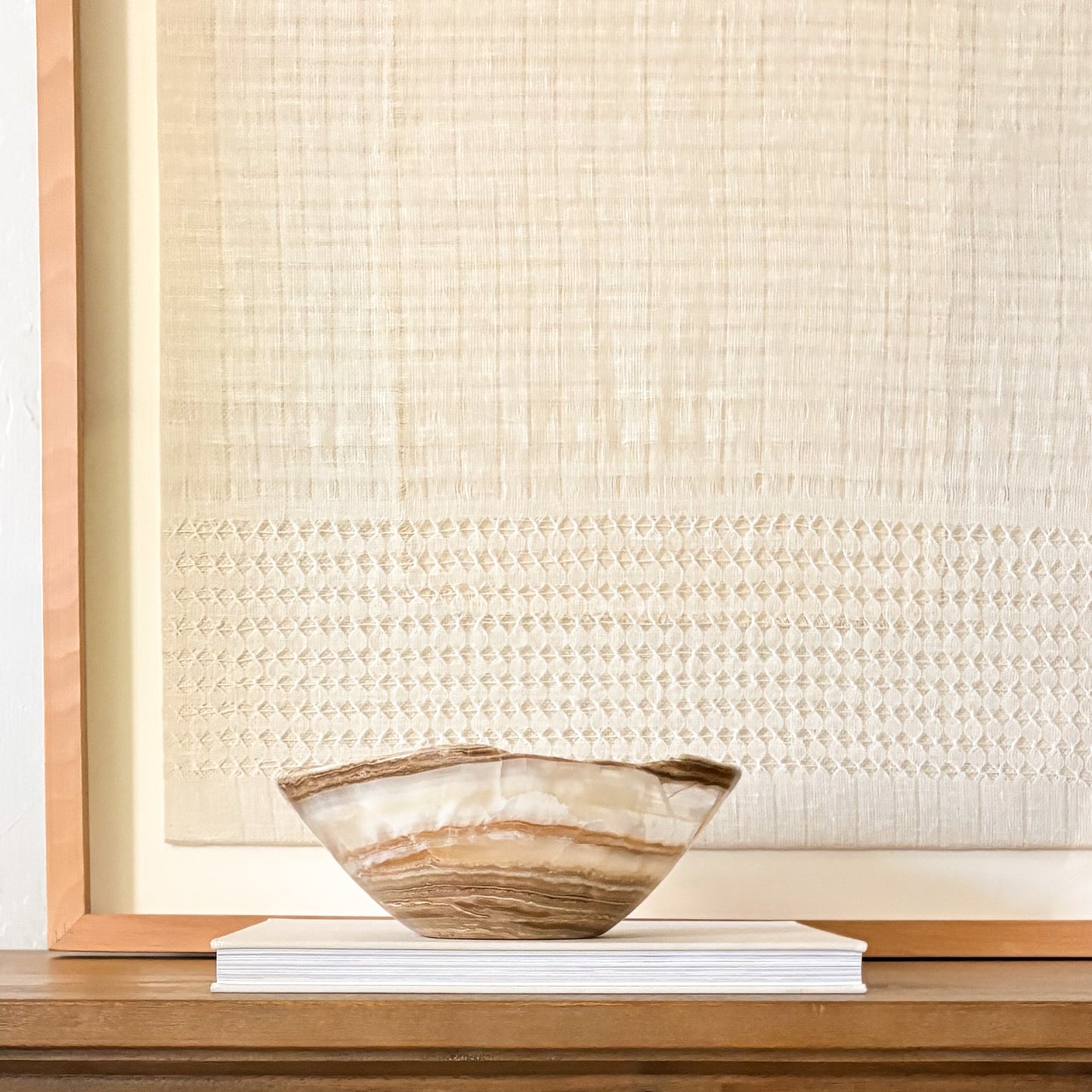 Decorative hand-carved amber onyx bowl made from genuine natural stone with warm golden tones