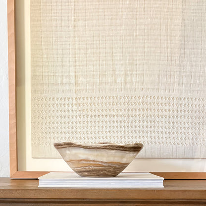 Amber onyx bowl hand carved from natural stone, polished decorative centerpiece