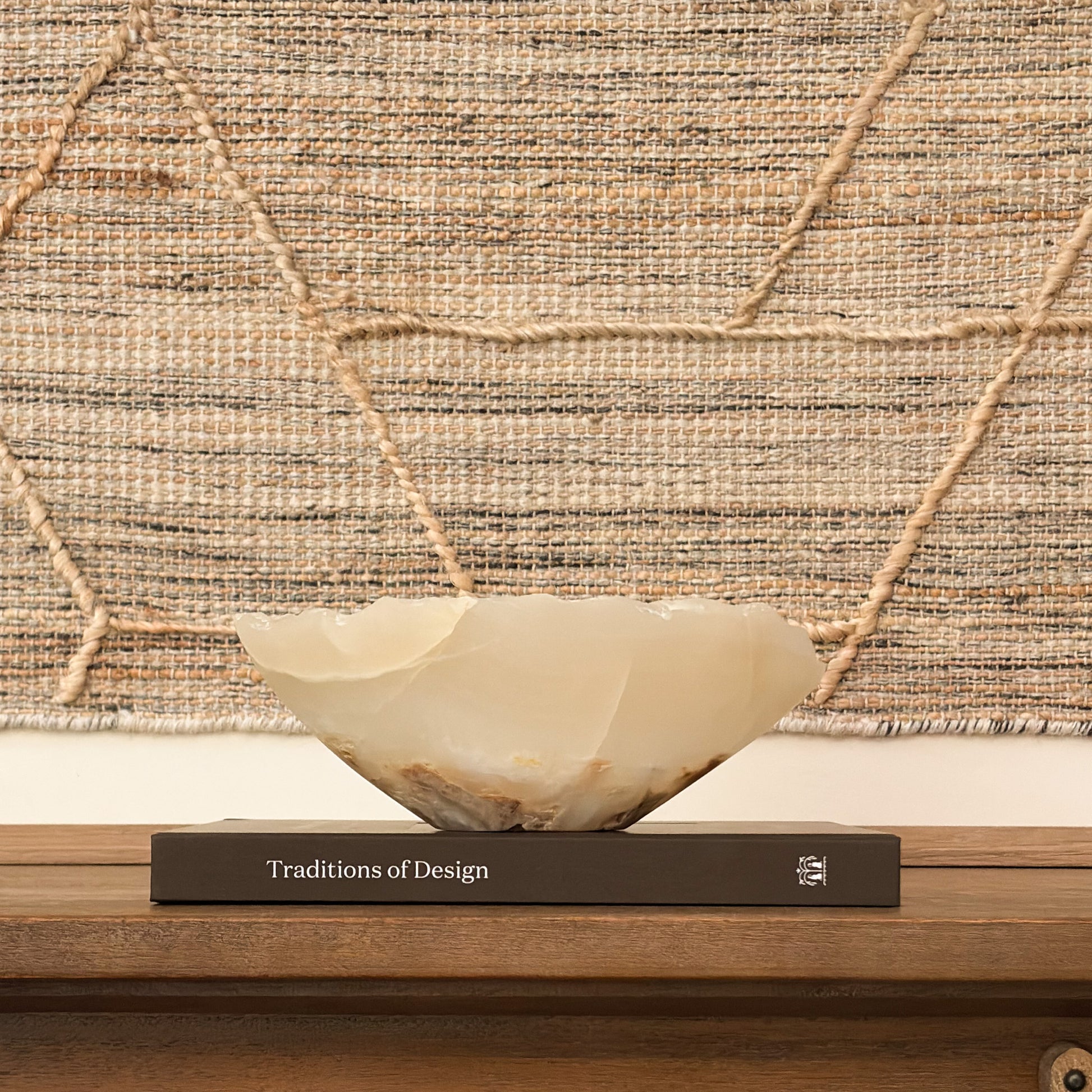Artisan carved amber onyx bowl featuring unique natural veining and rich earth tones