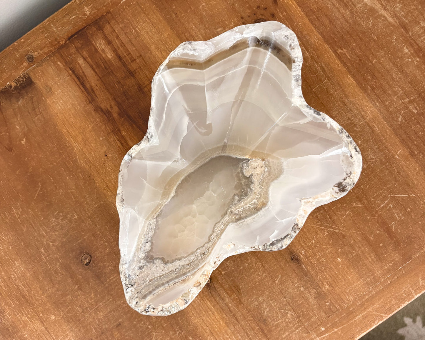 Amber onyx stone bowl with unique natural banding and veining