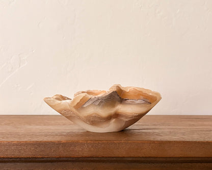 Hand-carved amber onyx bowl with natural veining