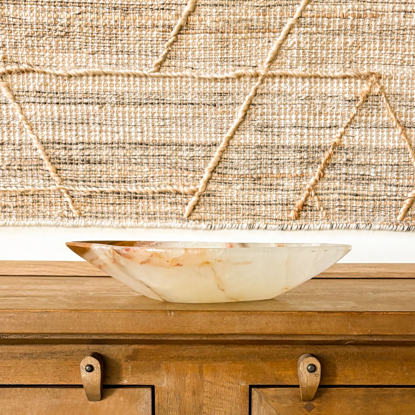 Brown onyx decorative bowl styled in modern rustic home decor setting