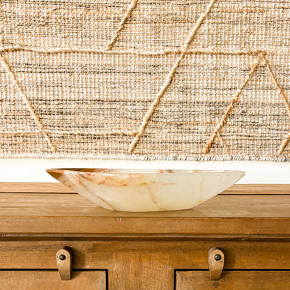 Brown onyx decorative bowl styled in modern rustic home decor setting