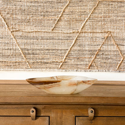 Natural stone onyx bowl centerpiece in warm minimalist interior