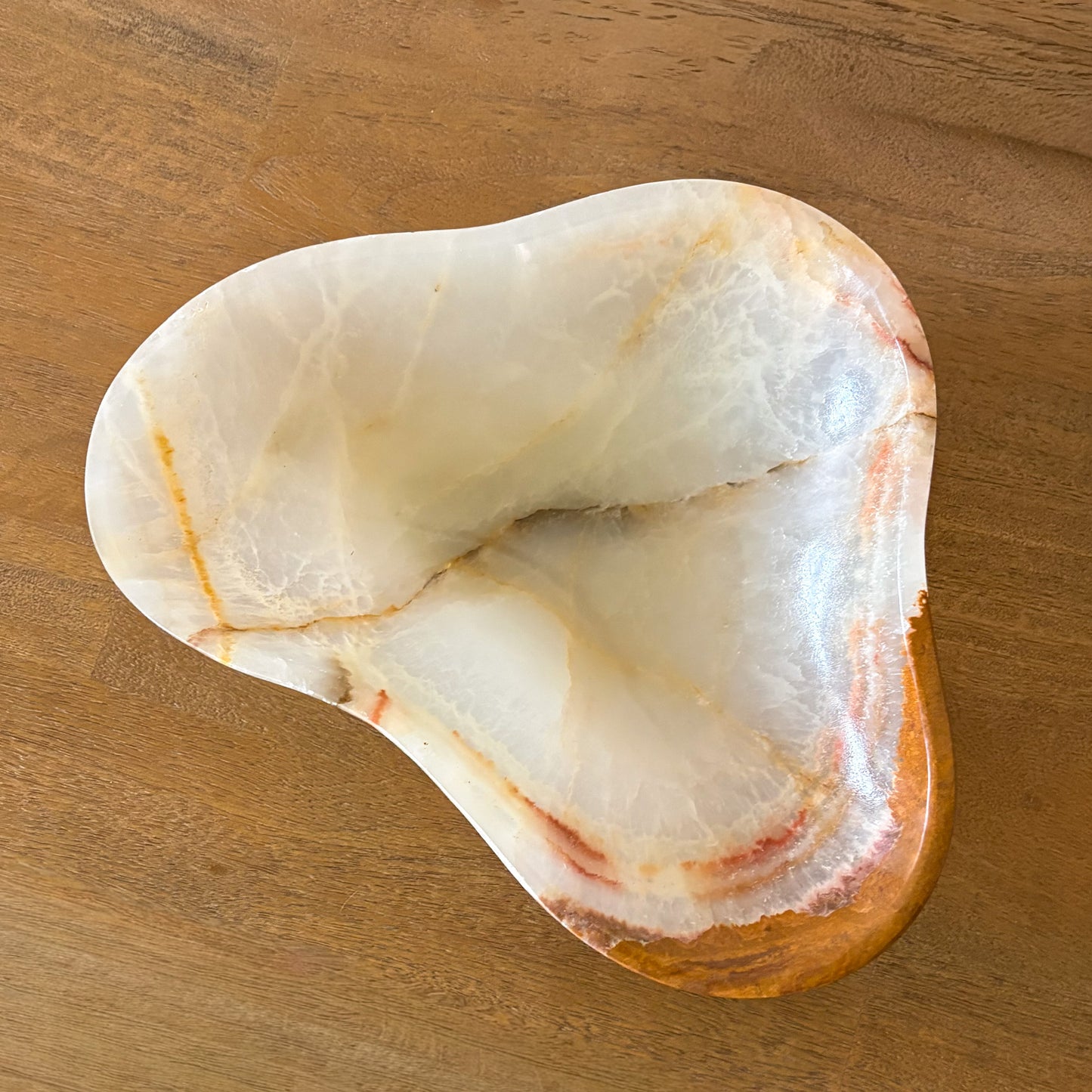 Neutral-toned interior featuring handcrafted onyx stone bowl