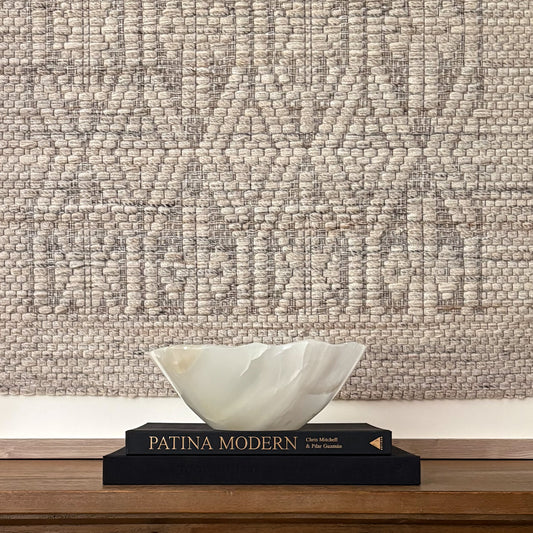 Hand-carved white onyx decorative bowl with natural stone veining