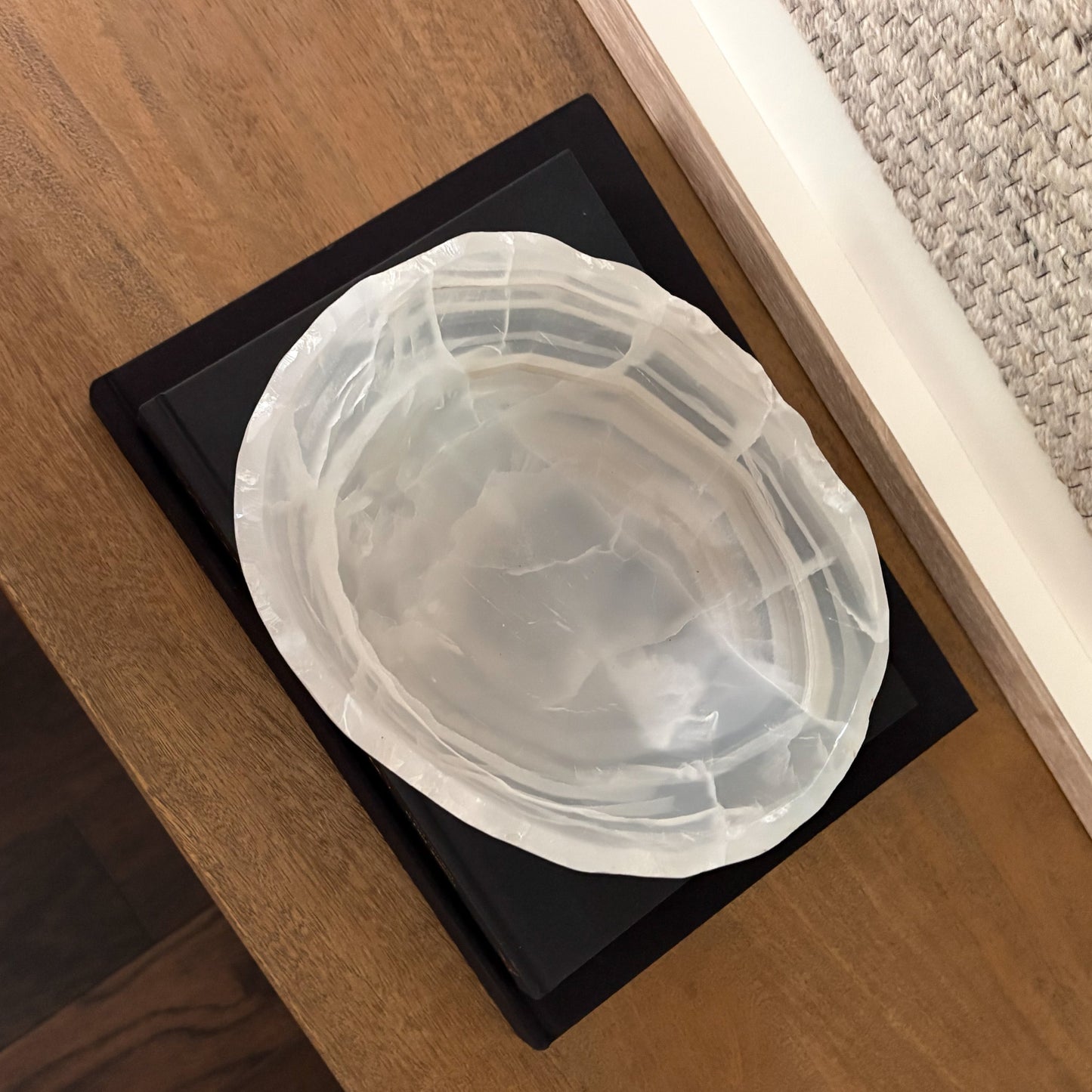 Decorative white onyx bowl with polished finish and natural veining