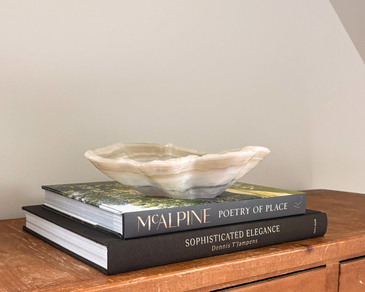 Grey onyx stone bowl with layered natural veining