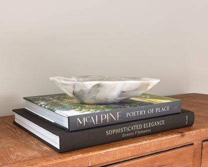 Grey onyx stone bowl with layered natural veining