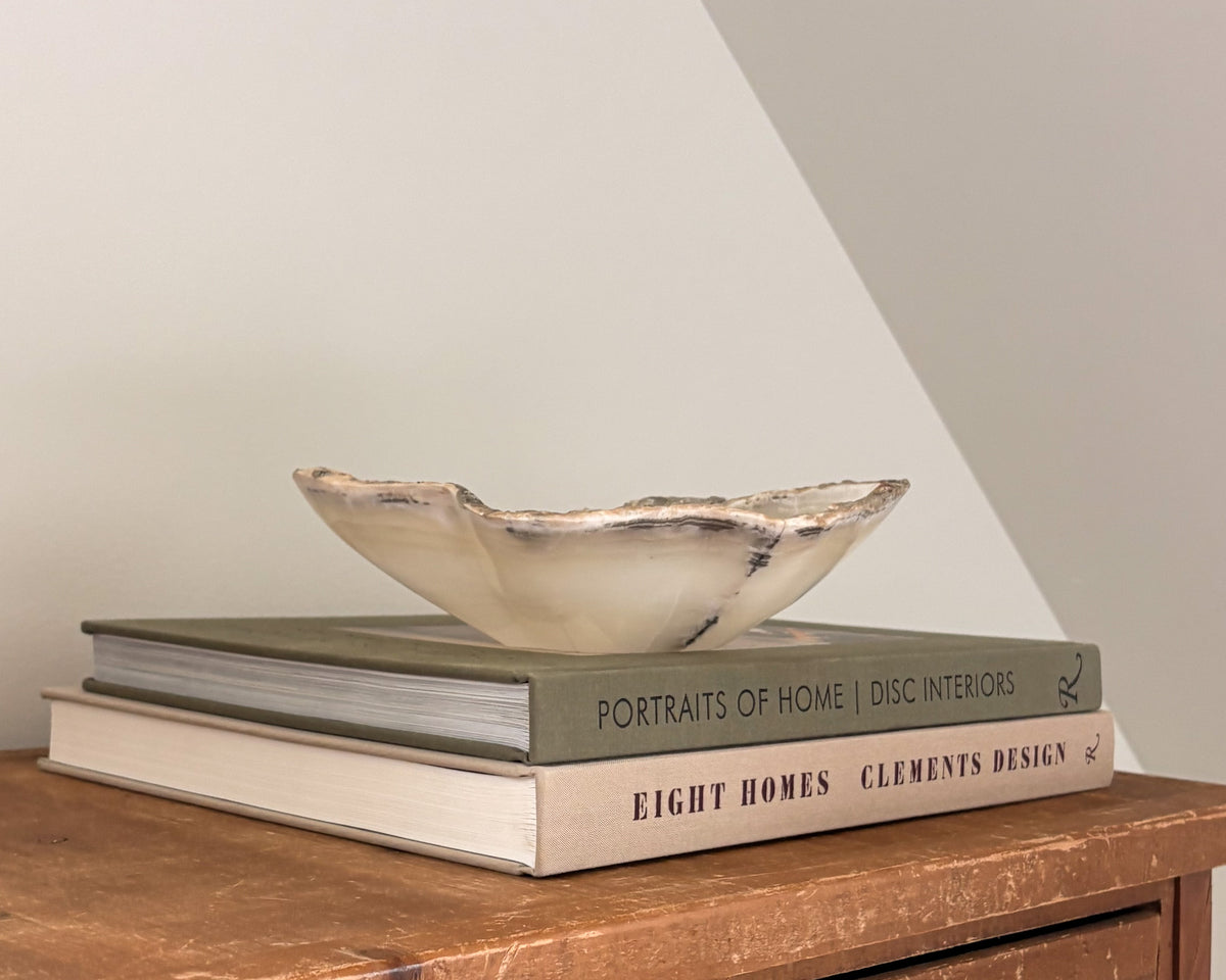 Grey onyx stone bowl with layered natural veining