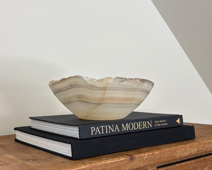 hand-carved grey onyx bowl with distinctive natural veining and polished stone finish.