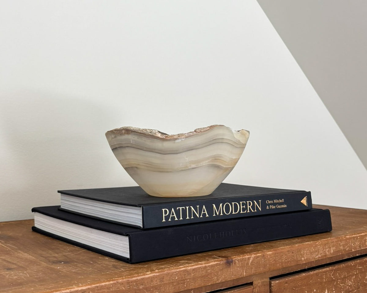 Decorative grey onyx stone bowl featuring organic patterns and unique tonal variations.