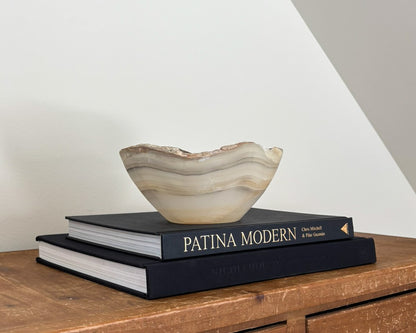 Decorative grey onyx stone bowl featuring organic patterns and unique tonal variations.