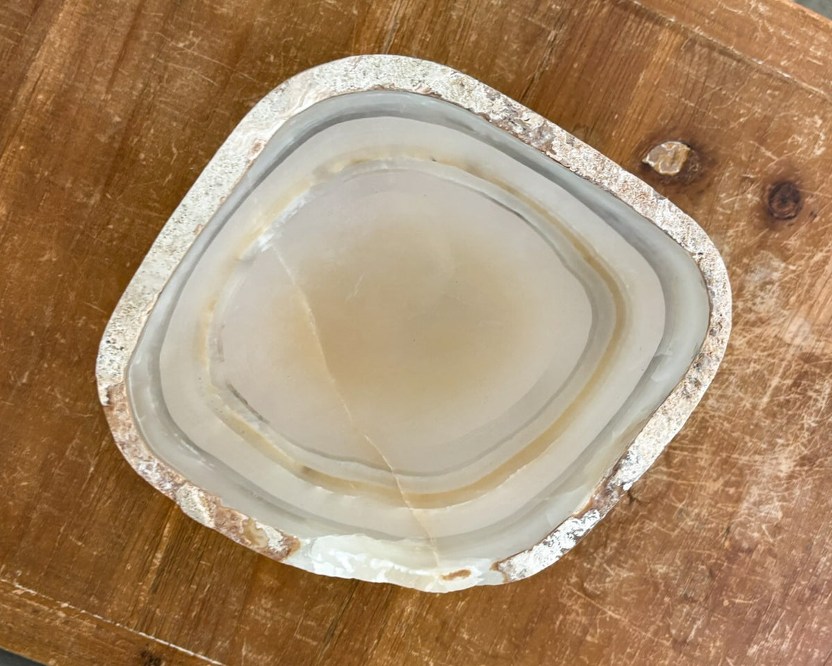 One-of-a-kind grey onyx bowl with natural mineral banding and a smooth, polished surface.