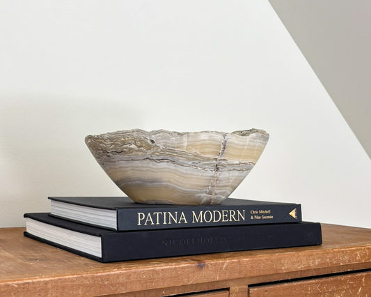 Hand-carved grey onyx bowl with distinctive natural veining and polished stone finish.