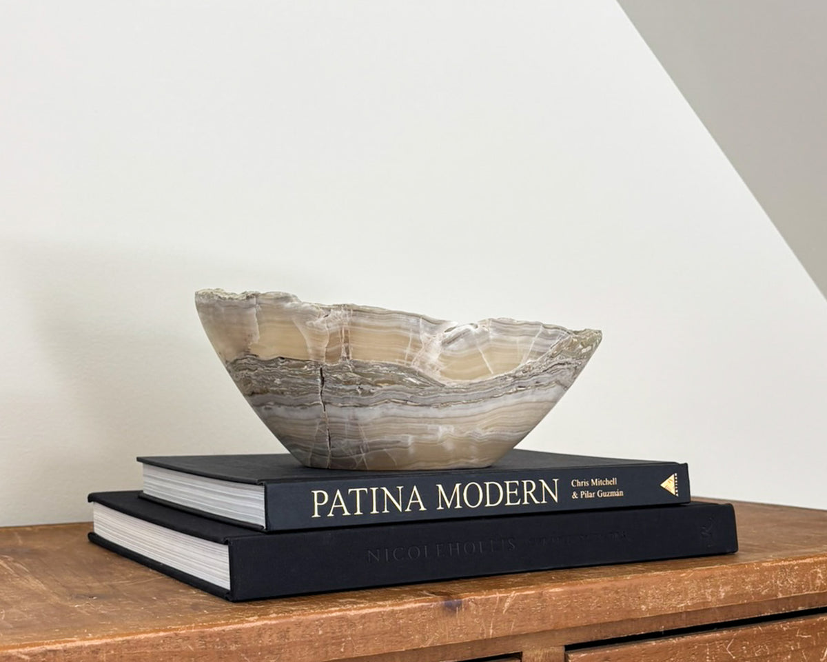 Decorative grey onyx stone bowl featuring organic patterns and unique tonal variations.