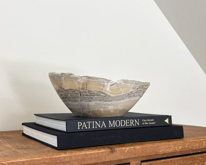 Decorative grey onyx stone bowl featuring organic patterns and unique tonal variations.
