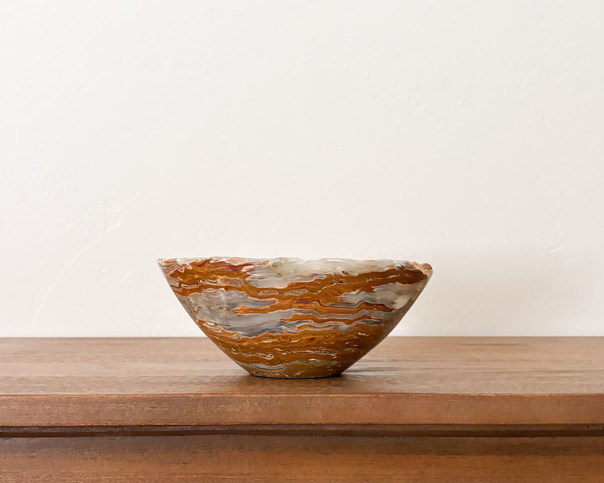 Hand-carved grey onyx bowl with natural stone veining and polished finish