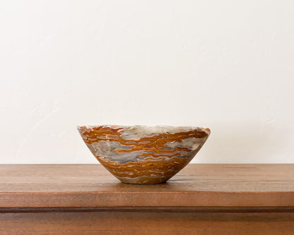 Hand-carved grey onyx bowl with natural stone veining and polished finish