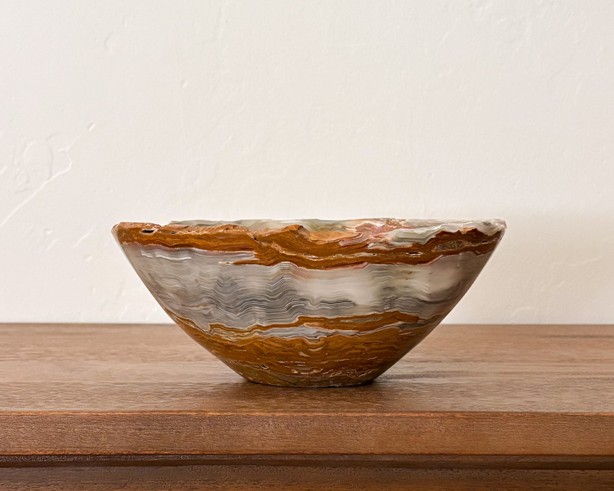 Sculptural grey onyx bowl with unique mineral patterns and smooth finish