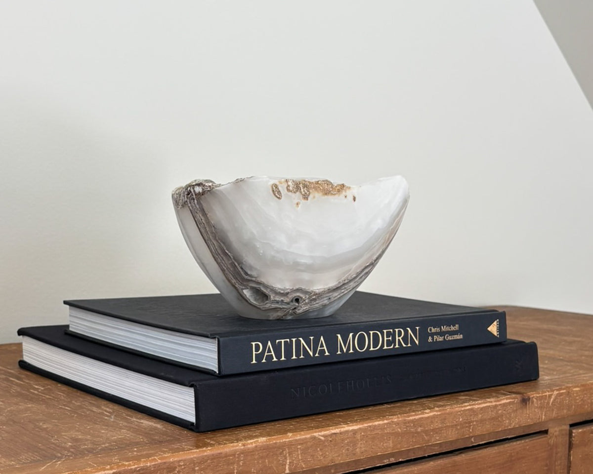 Polished grey onyx bowl featuring unique mineral patterns and tonal variations