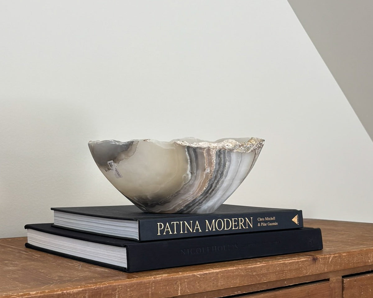 Hand-carved grey onyx bowl with natural stone veining and organic patterns