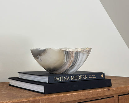 Hand-carved grey onyx bowl with natural stone veining and organic patterns