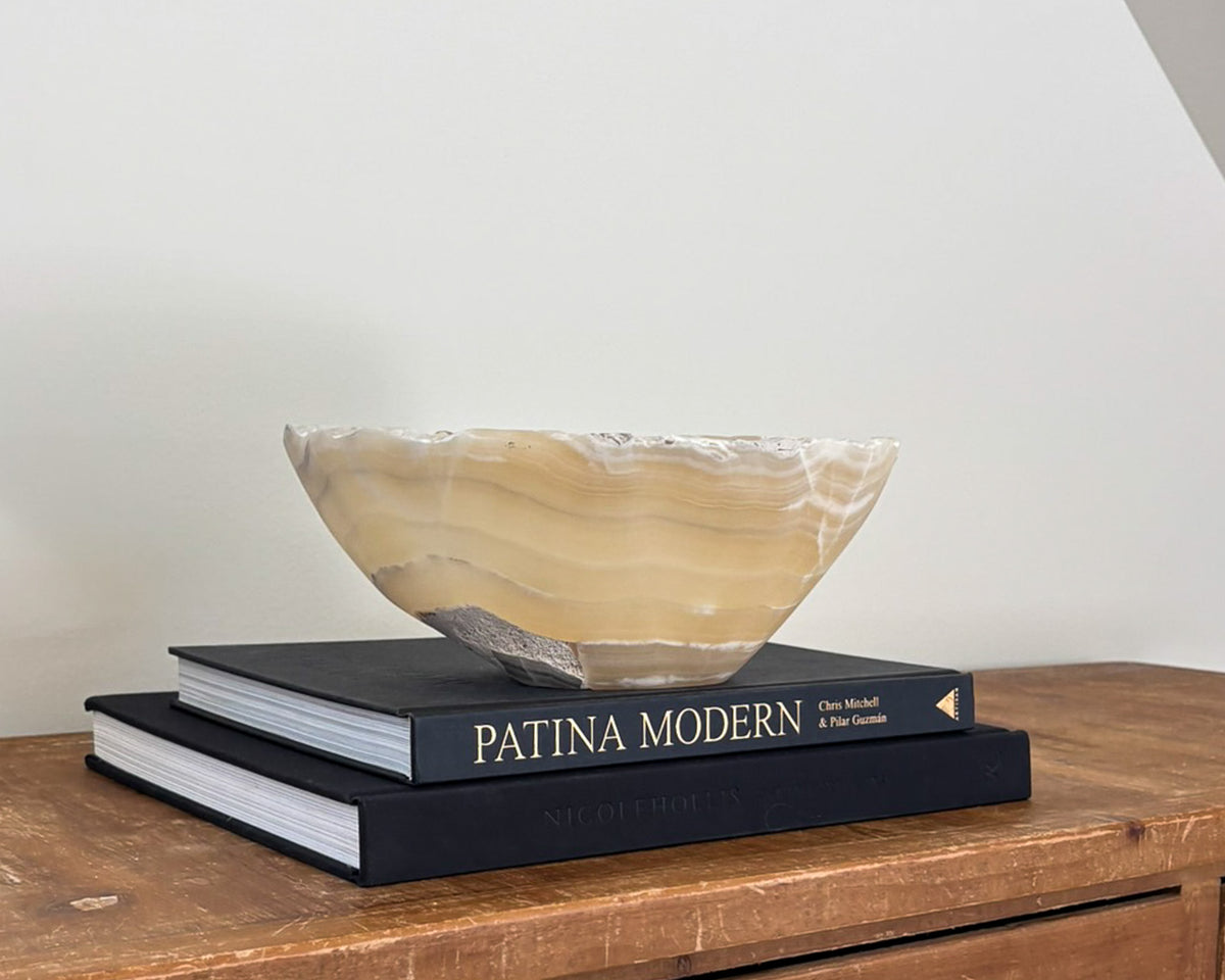 Small hand-carved amber onyx bowl with natural golden honey and cream veining