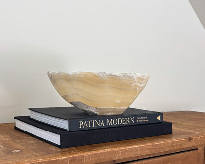 Small hand-carved amber onyx bowl with natural golden honey and cream veining
