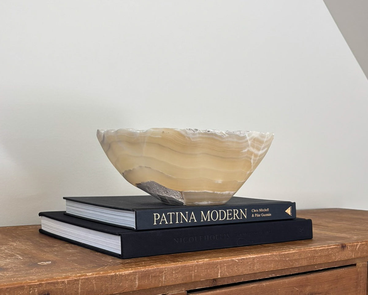 Decorative grey onyx stone bowl featuring organic patterns and polished finish