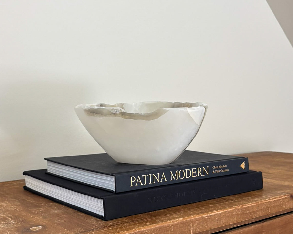 Grey onyx bowl featuring dramatic veining and natural stone texture