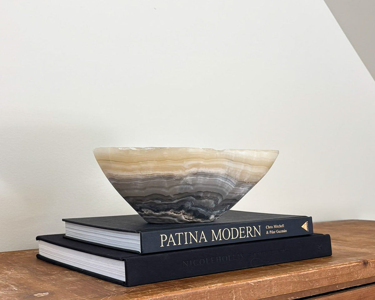 Decorative grey onyx stone bowl featuring organic patterns and polished finish