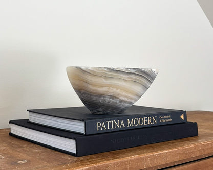 Polished grey onyx decorative bowl with unique mineral patterns