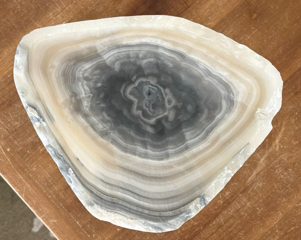 Grey onyx bowl featuring dramatic veining and natural stone texture