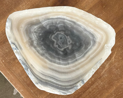 Grey onyx bowl featuring dramatic veining and natural stone texture