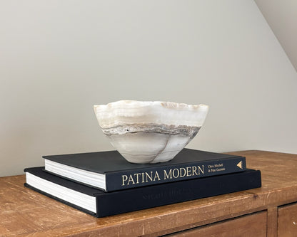 Polished grey onyx bowl featuring unique mineral patterns and tonal variations